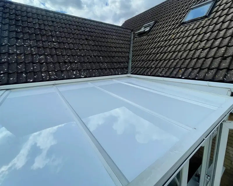 Glossy panel roof reflecting the clouds