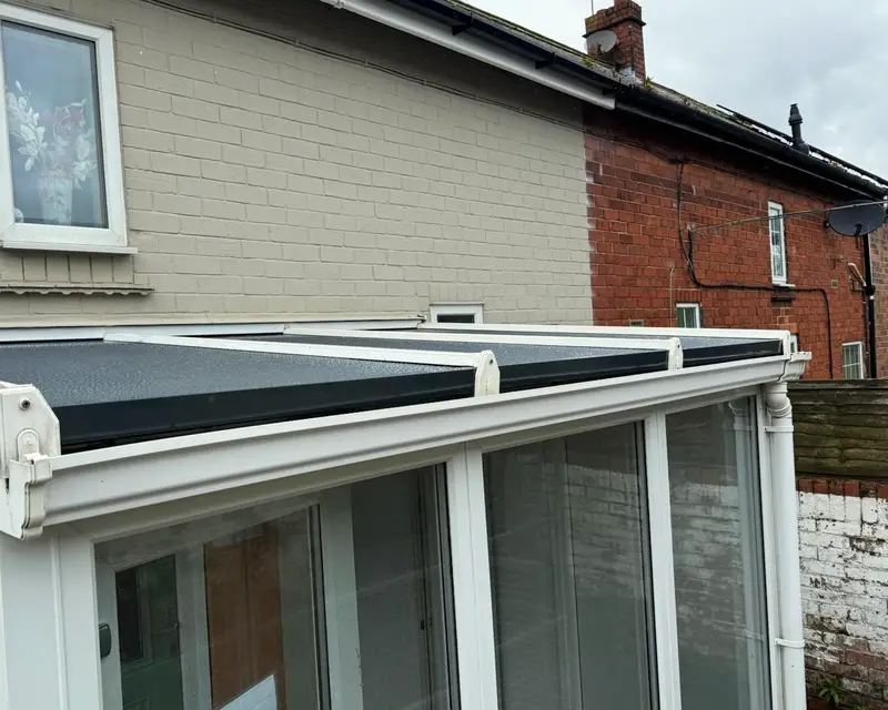 Dark grey insulated panel lean-to roof