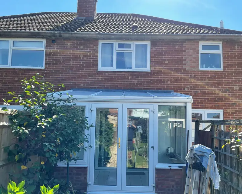 Lean-to panel roof on the back of a semi-detached house