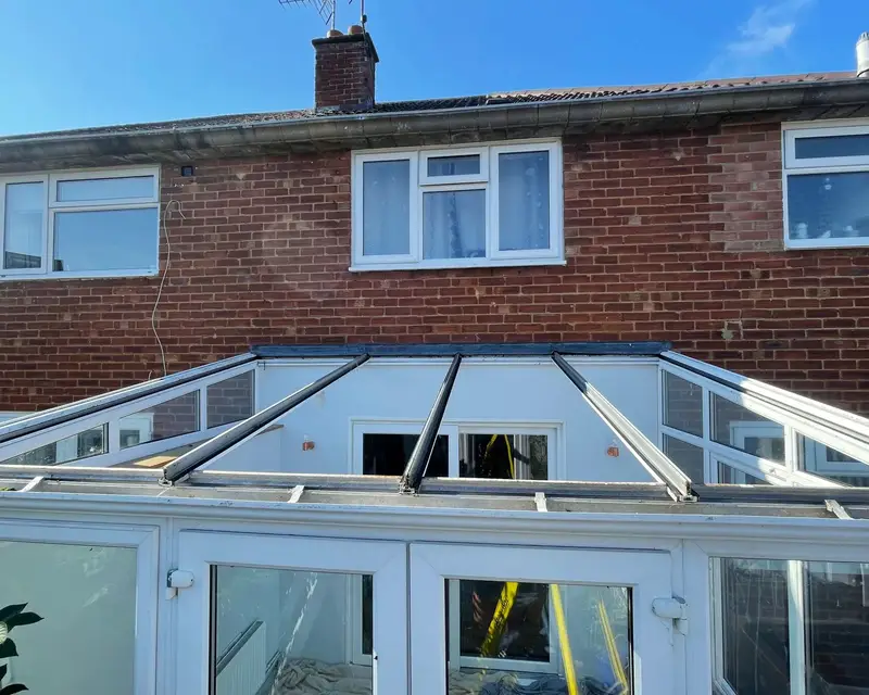 Lean-to conservatory roof stripped back to its frame