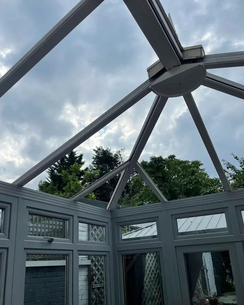 Stripped conservatory roof frame against the sky