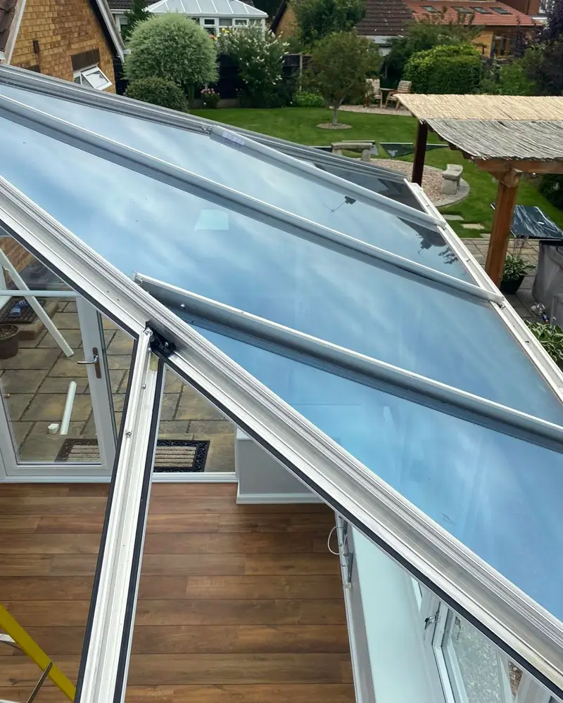 Grey insulated panels going onto a former glass conservatory roof